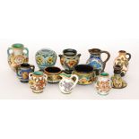 Twelve assorted small Gouda vases of varying form decorated in the typical manner with stylised