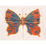 Kenneth Clark - A four 6in dust pressed tile panel decorated with a brightly glazed butterfly,