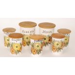 Crown Devon Fieldings - A collection of 1960s kitchen storage jars each decorated with a spray of