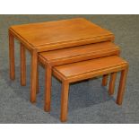 Gordon Russell Furniture - A nest of three teak coffee tables, with stepped rectangular tops,