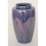 Ruskin Pottery - A vase of high shouldered form with roll rim neck decorated in an all over lilac