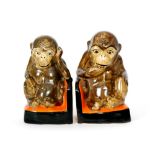 Myott - A pair of 1930s book ends in the form of seated chimpanzees with enamelled decoration