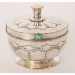 Unknown - An Arts and Crafts silver plated circular covered bowl with embossed geometric decoration,