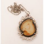 Unknown - A 1970s silver and agate pendant the claw set agate within a pierced frame of