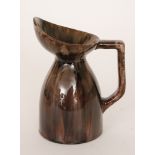 Christopher Dresser - Linthorpe Pottery - A shape 610 angular jug glazed in a streaked tonal brown,