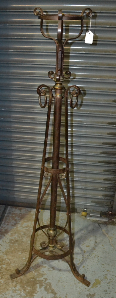 Unknown - An early 20th Century Arts and Crafts wrought iron standard lamp with a flattened scroll