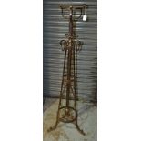 Unknown - An early 20th Century Arts and Crafts wrought iron standard lamp with a flattened scroll