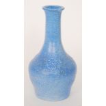 Ruskin Pottery - A crystalline mallet vase decorated in a tonal blue with mottled green spotting,