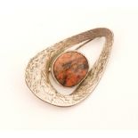 Unknown - A 1970s Swedish silver and rhodonite brooch of eliptical outline wih textured surface