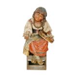 Bretby - A large late 19th Century polychrome terracotta figure of a young gypsy girl sat on a