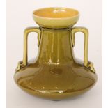 Attributed to Christopher Dresser - Linthorpe Pottery - A shape 957 twin handled vase glazed in