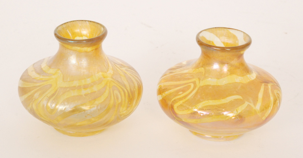 Kralik - A pair of early 20th Century glass vases of low shouldered form decorated with self