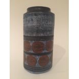 Troika Pottery - A cylinder vase decorated by Ann Pascoe with brown discs and black banding over a