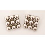Unknown - Mexican - A pair of mid-century silver clip earrings with nine united hemispheres in