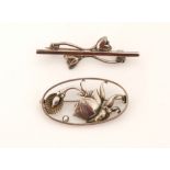 Georg Jensen - A Danish Sterling silver brooch designed with stylised flowerheads within an oval
