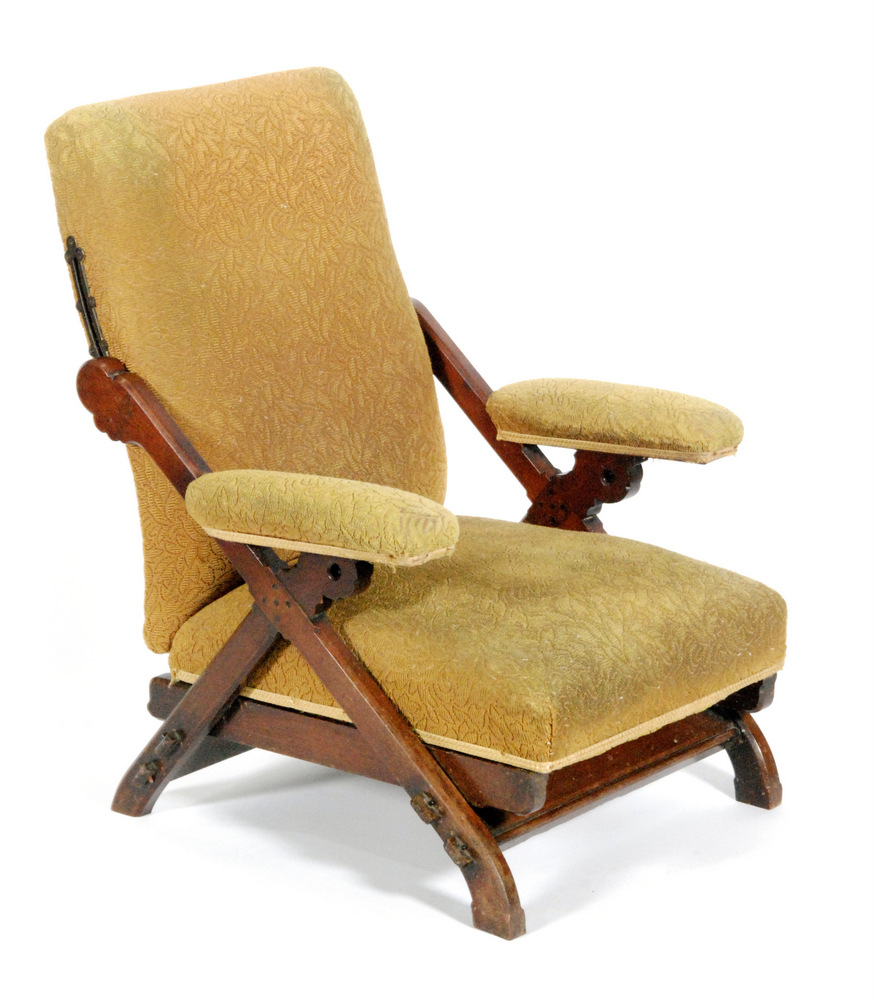 In the manner of James Shoolbred - A mahogany framed adjustable armchair in the Gothic revival