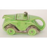 Sadler - A 1930s teapot modelled as a green racing car with silver lustre trims,