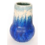 Ruskin Pottery - A crystalline glaze vase decorated in a pale blue to cream to dark blue with