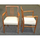 Four Gordon Russell teak model X6409 elbow or carver chairs. (4) N.B.