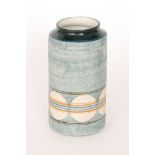 Honor Curtis - Troika - A cylinder vase decorated with a lower band of discs in white with mustard