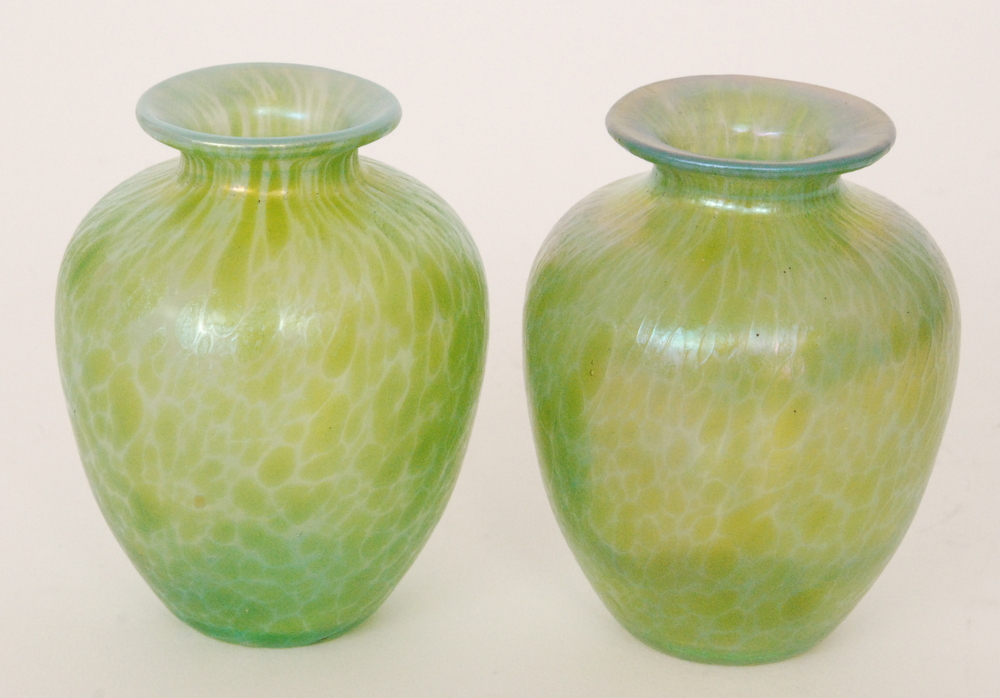 In the manner of Loetz - A pair of glass vases of shouldered form below a short flared collar neck