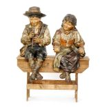 Bretby - Two late 19th Century polychrome terracotta figures of children,