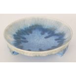 Ruskin Pottery - A crystalline glaze shallow tri-footed bowl glazed in a tonal blue against a cream