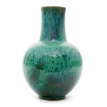 Ruskin Pottery - An early 20th Century vase of globe and shaft form decorated in a mottled and