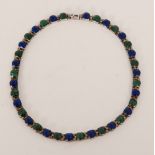Unknown - A Mexican Sterling silver malachite and blue stone collarette designed with thirty six