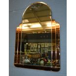 Unknown - An arch topped, bevelled edged wall mirror with stepped peach glass detailed border,