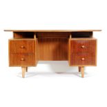 In the manner of Trevor Chinn for Gordon Russell Furniture - A rosewood veneered twin pedestal desk