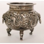 A late 19th Century Chinese silver salt of cauldron form with baluster body on three dragon feet