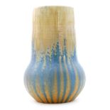 A Ruskin Pottery crystalline glaze vase decorated in a pale yellow to pale blue to orange with