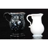 A late 18th Century Wrockwardine glass jug of footed ovoid form with an applied loop handle