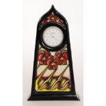 A Moorcroft Pottery mantel clock decorated in the Dames Pansy pattern designed by Kerry Goodwin,