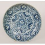 A Chinese Diana Cargo blue and white 'Starburst' shallow dish decorated with a stylised repeat