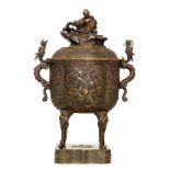 A late 19th to early 20th Century Japanese bronze censer and cover of ovoid form,