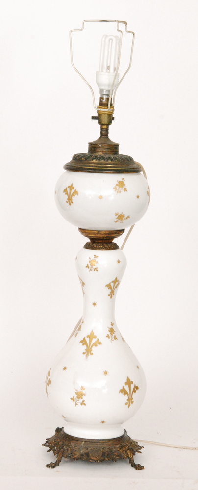 A late Victorian baluster white opaque and gilt overpainted oil lamp,