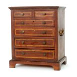 An Edwardian mahogany and satinwood crossbanded apprentice chest of two short and four long