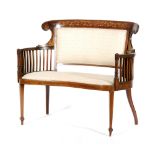 An early 20th Century mahogany kidney shaped settee,