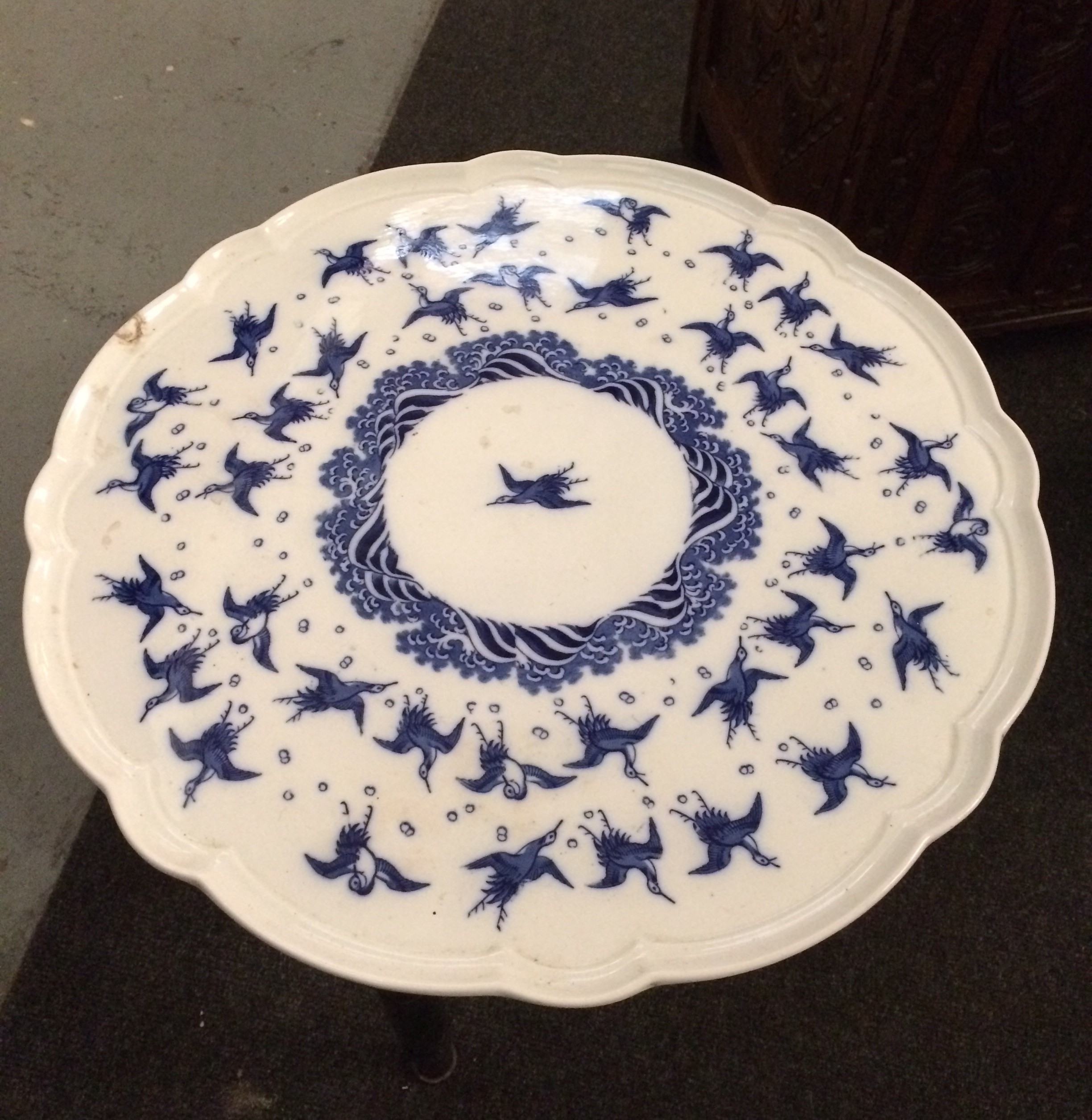 A late 19th Century occasional table with blue ceramic swivel top on ebonised legs, - Image 2 of 3