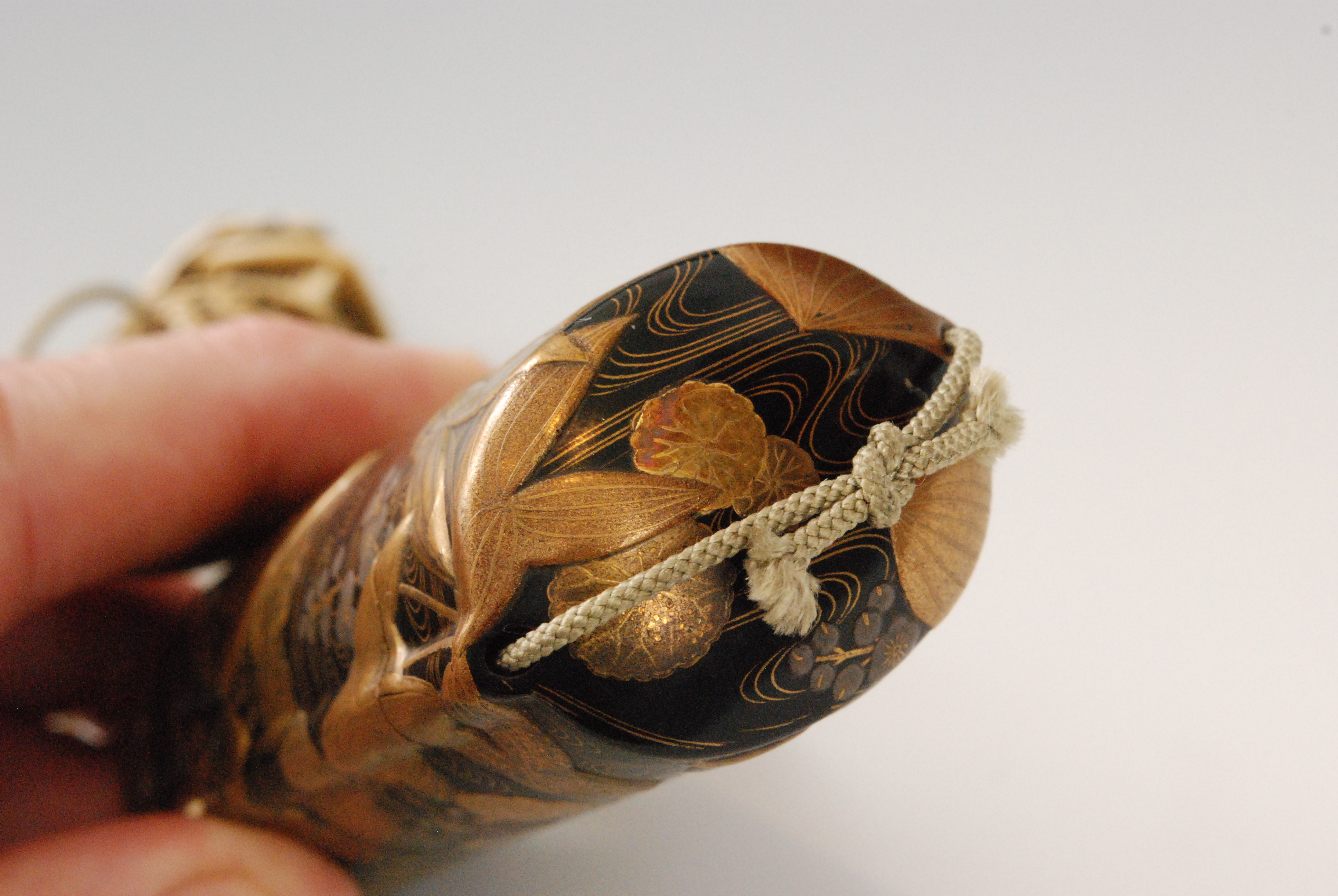 An early 19th Century five case inro finely decorated with water plants in a rippling stream in - Image 7 of 9