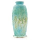 A 1930s Ruskin Pottery crystalline glaze footed vase decorated in a mottled and streaked tonal blue