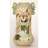 A large early 20th Century vase decorated with tubelined iris against a pale orange ground,