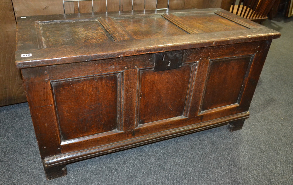 An 18th Century triple panelled oak coffer on stiles,