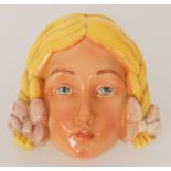 A Beswick model 393 wall mask formed as a young girl with blonde plaited hair,
