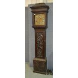 An 18th Century and later carved oak longcase clock with eight day striking movement,