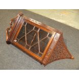 An Edwardian Chippendale style mahogany hanging corner cabinet,