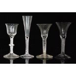 A group of four 18th Century drinking glasses comprising two multi series air twist examples,