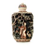 A 19th Century Chinese part stained ivory snuff bottle carved in deep relief with figures between